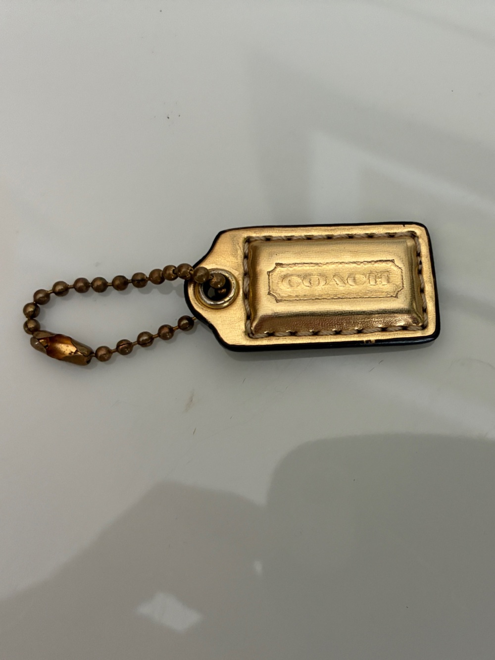 Coach Metallic Gold Leather Tag